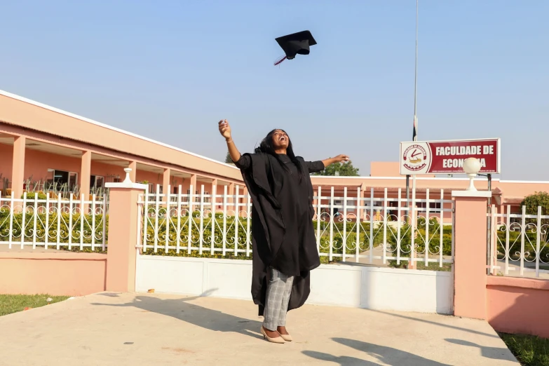 a woman throwing a graduation cap in the air, by Ingrida Kadaka, ground level shot, emir, private academy entrance, profile image