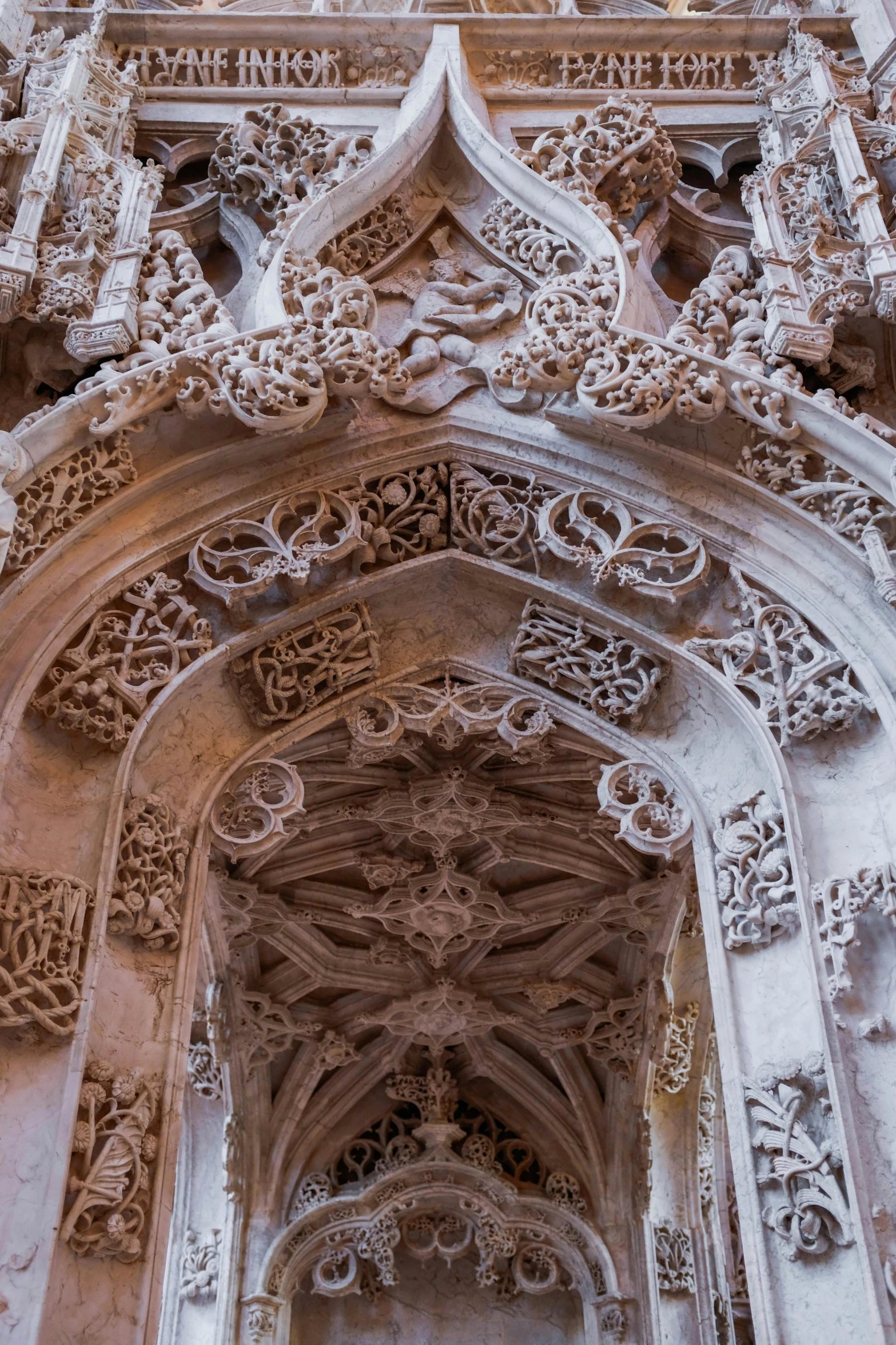 a very tall building with a clock on top of it, a marble sculpture, by Gaudi, pexels contest winner, arabesque, archways between stalagtites, detailed lacework, portugal, detailed innards