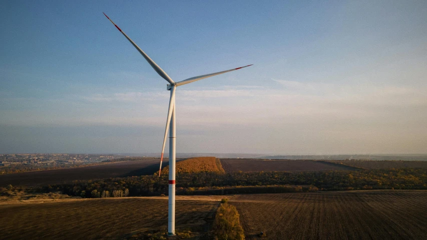 a wind turbine in the middle of a field, by Adam Marczyński, pexels contest winner, high above the ground, sustainable materials, 15081959 21121991 01012000 4k, portrait of a big