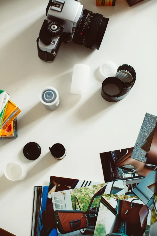 a white table topped with pictures and a camera, unsplash, visual art, ingredients on the table, high contrast plastic, medium format, ad image