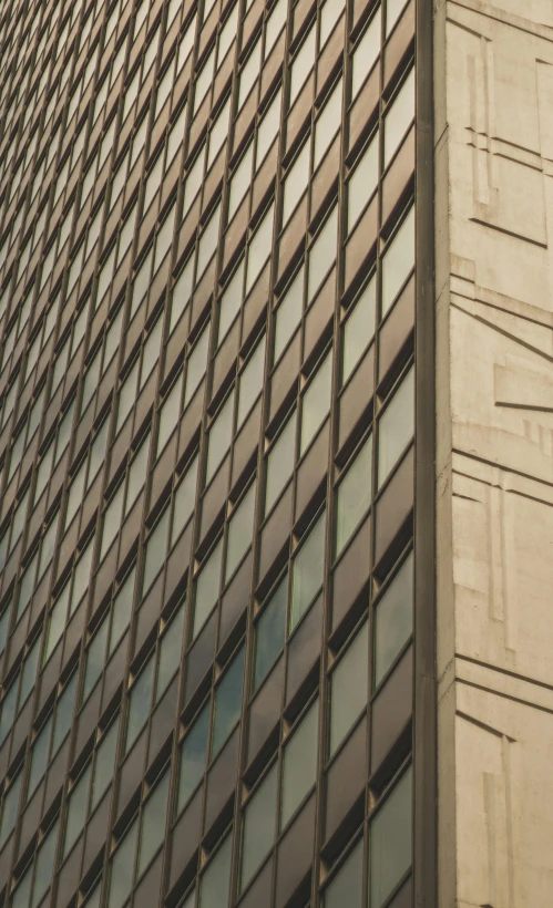 a clock mounted to the side of a tall building, inspired by Andreas Gursky, high texture detail, brown, modern chicago streets, painted metal and glass