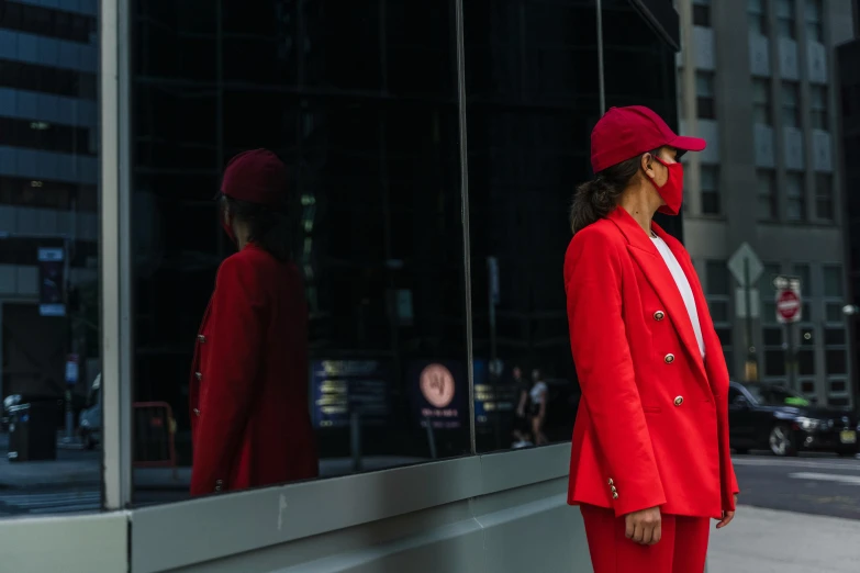 a woman in a red suit and a red hat, pexels contest winner, outlive streetwear collection, more reflection, wearing business suit, instagram post