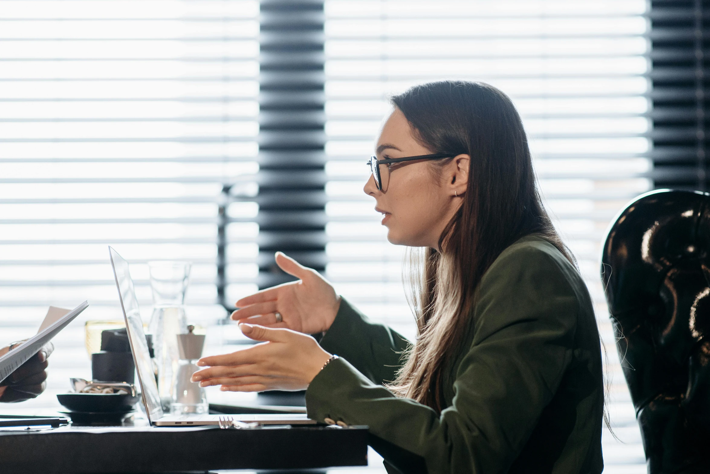 a man and a woman sitting at a table talking, unsplash, worksafe. instagram photo, royal commission, computer, realistic »