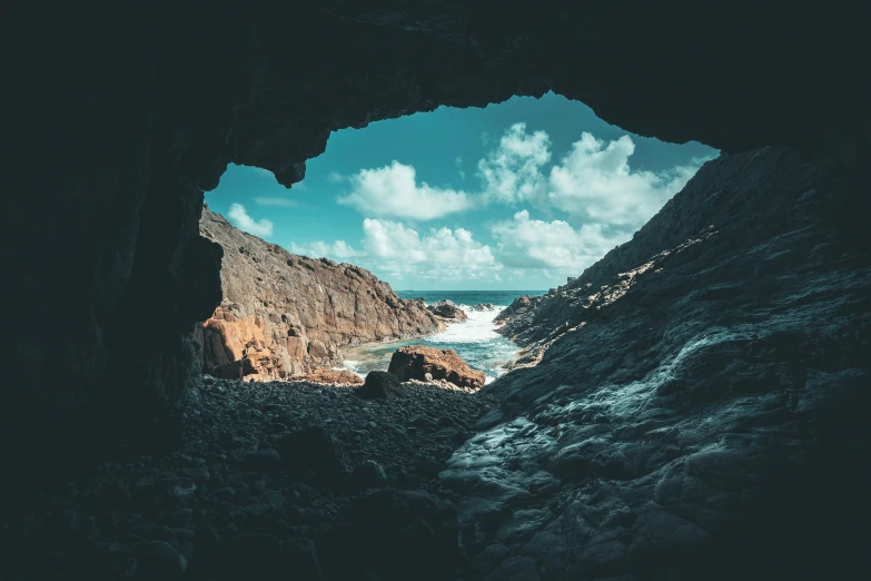 a view of the ocean from inside a cave, by Matthias Weischer, unsplash contest winner, visual art, cornwall, 4k/8k, the middle of a valley, cave prison