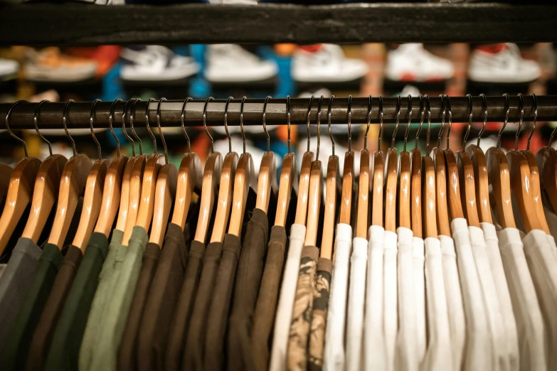 a rack of clothes in a clothing store, by Matija Jama, unsplash, 🦩🪐🐞👩🏻🦳, super detailed image, loosely cropped, streetwear