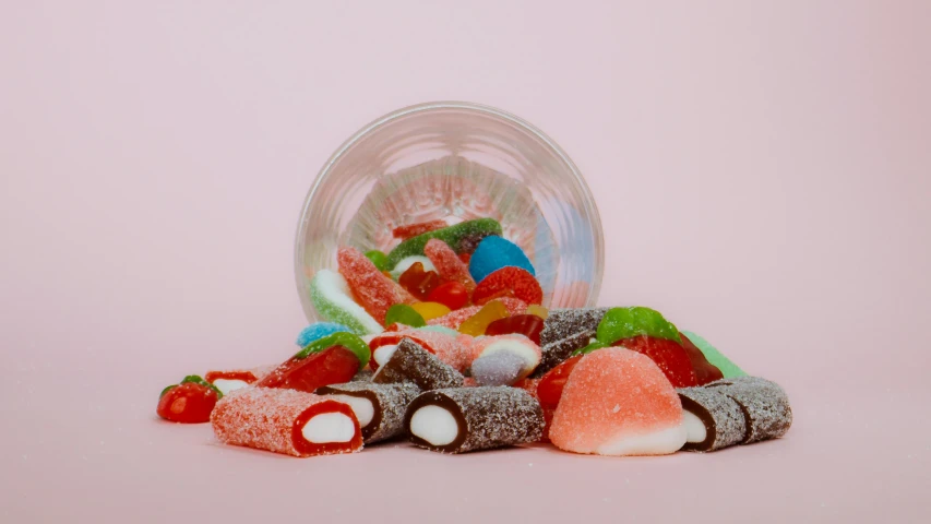 a jar full of candy sitting on top of a table