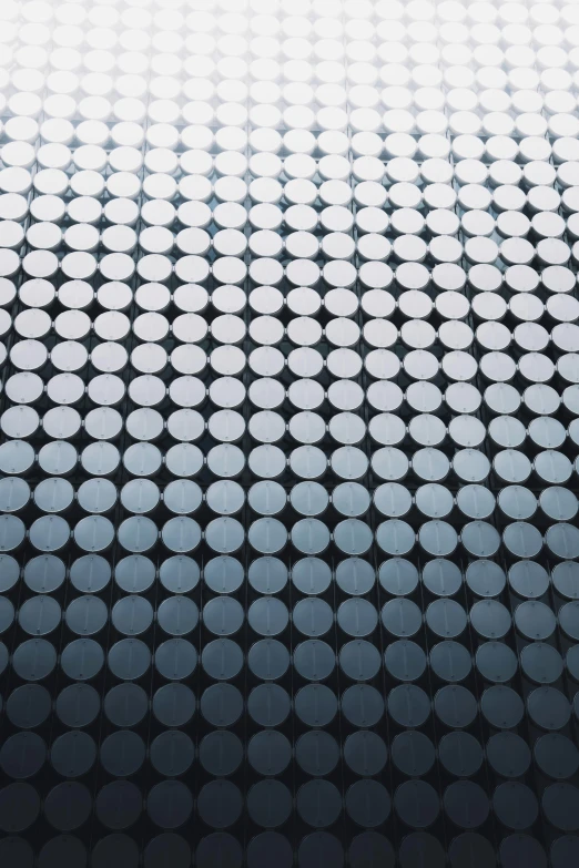 a black and white background with circles, by Victor Vasarely, unsplash, silver and blue colors, seamless micro detail, dot gradient, detailed product shot