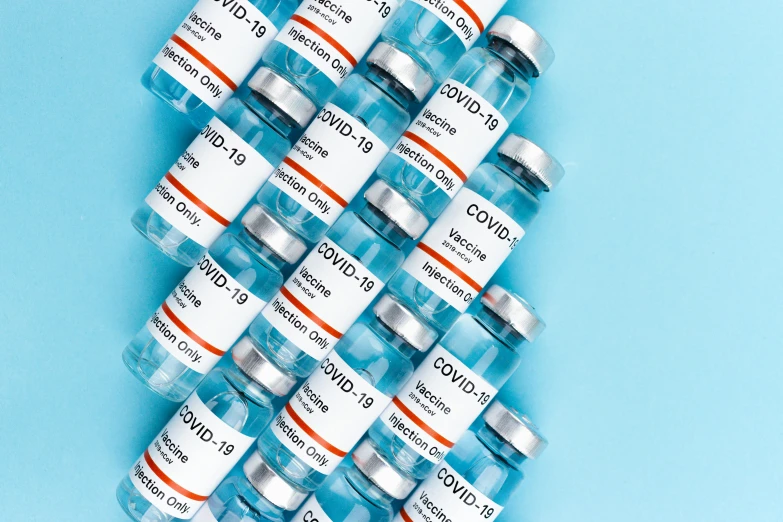 a pile of medicine bottles sitting on top of a blue surface, listing image, 1 6 x 1 6, covid, medical labels