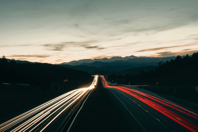 a long exposure photo of a highway at dusk, a picture, unsplash contest winner, hills in the background, running lights, thumbnail, ansel ]