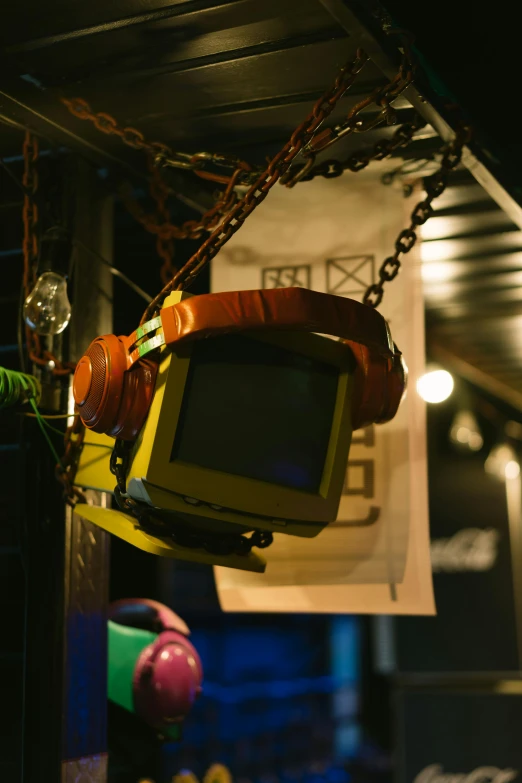 a television hanging from a ceiling in a room, by Miyamoto, neo-dada, cyberpunk ornaments, deserted shinjuku junk town, cyberpunk headset, medium close up shot