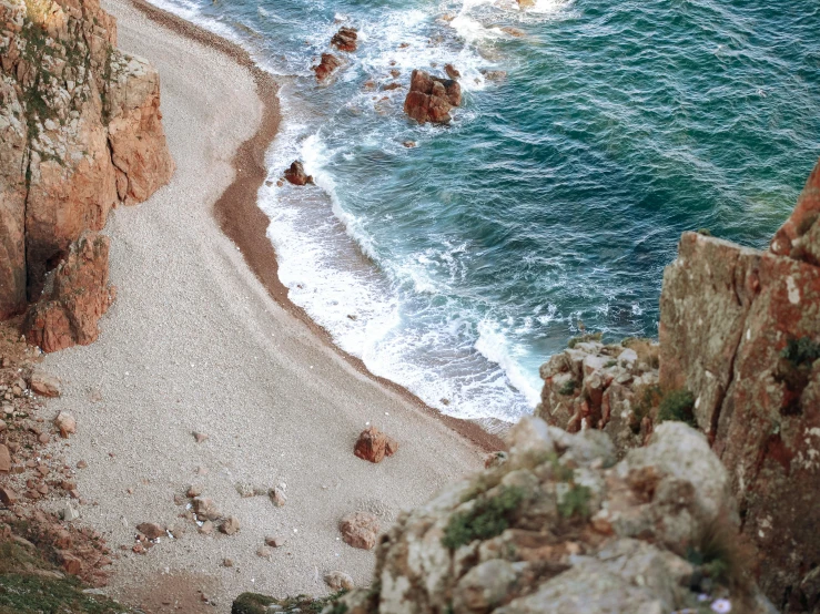 a couple of people standing on top of a cliff next to the ocean, by Raphaël Collin, pexels contest winner, flatlay, brown, sparkling cove, medium format. soft light