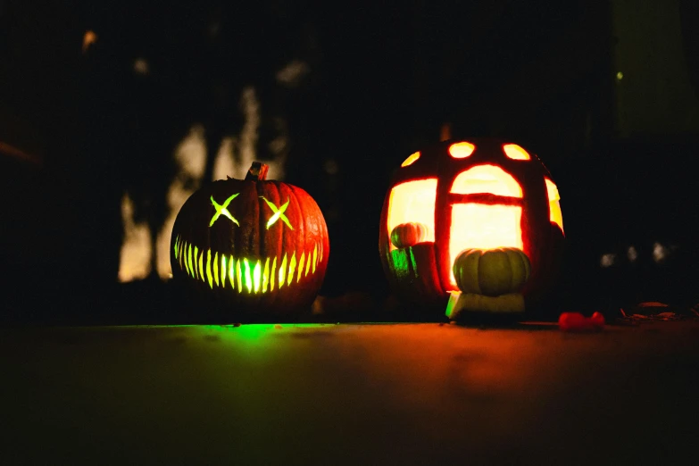 a couple of pumpkins sitting on top of a table, by Sebastian Vrancx, pexels, made of glowing wax, bright glowing instruments, menacing, instagram picture
