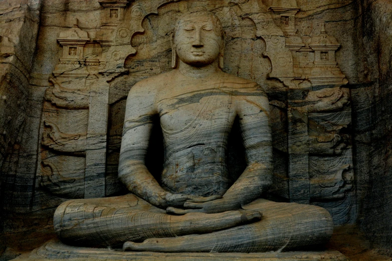 a statue of a person sitting in a meditation position, by Sam Dillemans, pexels contest winner, hurufiyya, sri lanka, sandstone, promo image, thumbnail