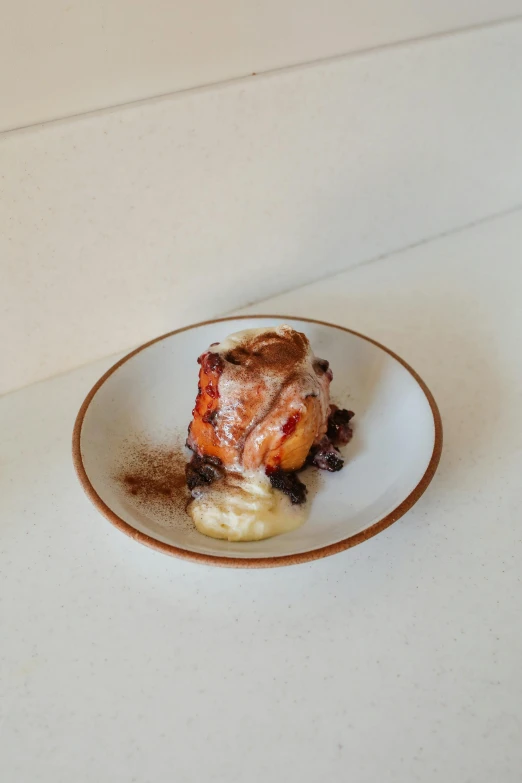 a close up of a plate of food on a table, by Gavin Hamilton, in the shape of a cinnamon roll, charred, port, square