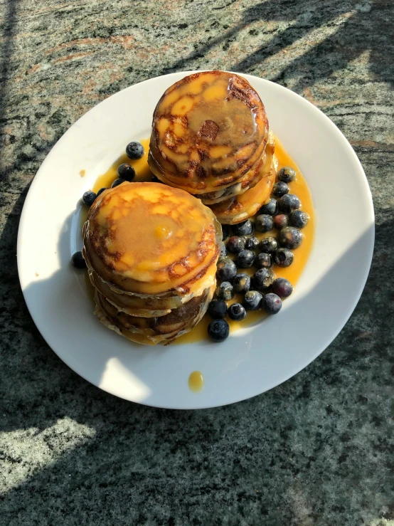a white plate topped with pancakes and blueberries, reddit, two organic looking towers, low quality photo, made of glazed, thumbnail