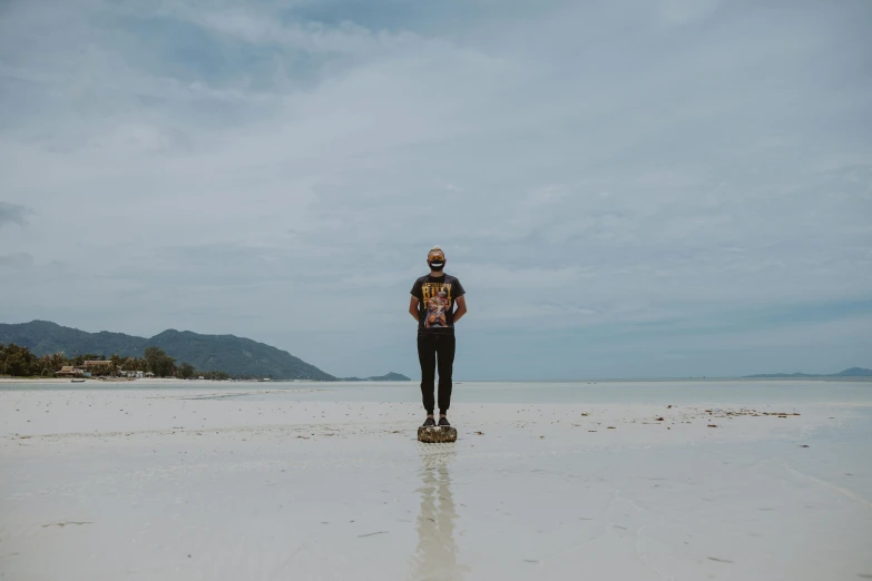 a man standing on top of a skateboard on a beach, inspired by Seb McKinnon, standing on a lotus, white sand, avatar image, portrait mode photo