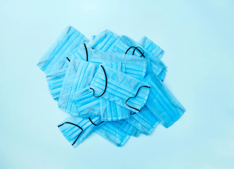a pile of blue disposable face masks, unsplash, on a pale background, 1 6 x 1 6, surgeon, overview