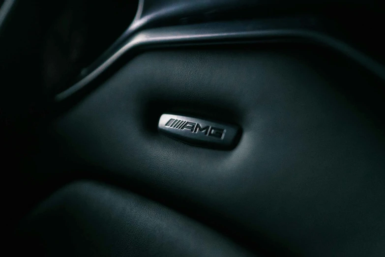 a close up of the emblem of a car, by James Bard, unsplash, black leather, gaming chair, mercedez benz, promo photo