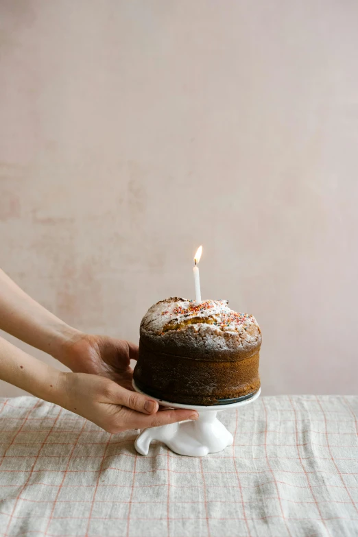 a person lighting a candle on top of a cake, by Liza Donnelly, dwell, large tall, brown, freckle