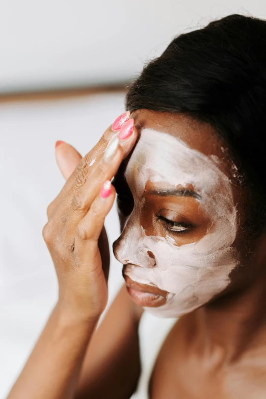 a woman putting a face mask on her face, trending on pexels, renaissance, brown skin like soil, thumbnail, full body image, showing forehead