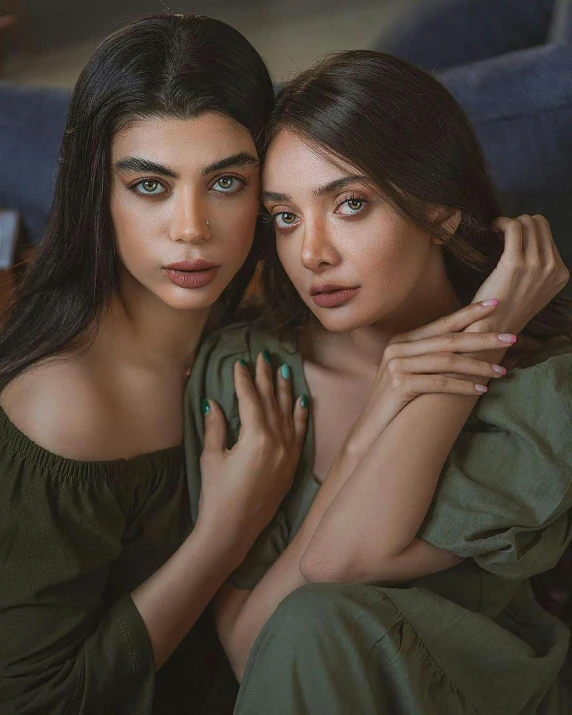 two women sitting next to each other on a couch, a colorized photo, by irakli nadar, trending on instagram, hurufiyya, with deep green eyes, behance lemanoosh, attractive girl, r / paintedminis