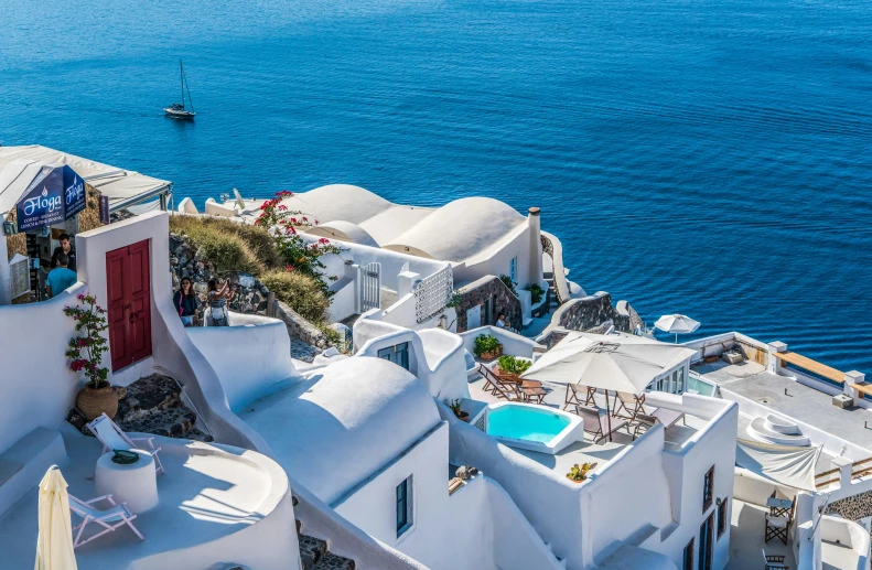 a view of the ocean from the top of a building, pexels contest winner, art nouveau, white houses, greek pool, avatar image