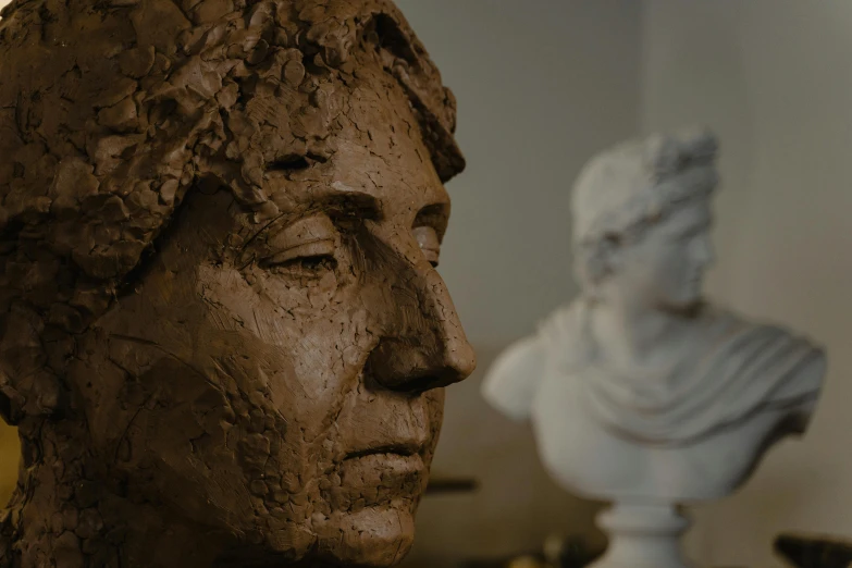 a bust of a woman sitting next to a bust of a man, inspired by Andrea del Verrocchio, new sculpture, clay texture, close - up on face, nft portrait, pottery