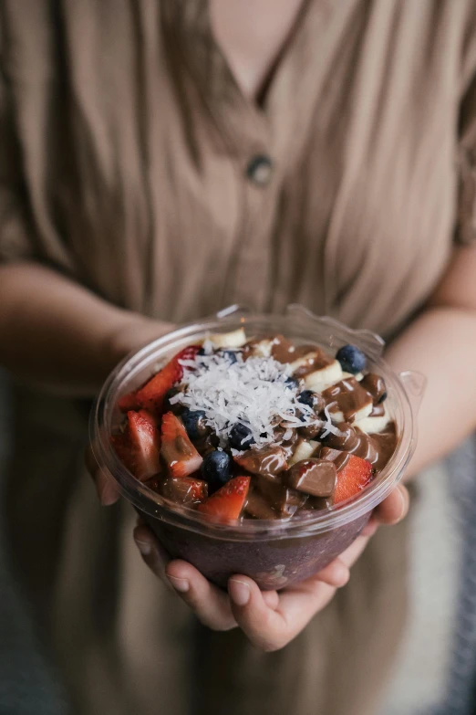 a close up of a person holding a bowl of food, by Robbie Trevino, trending on unsplash, fuji choco, slush, 🎀 🍓 🧚, 2806927615