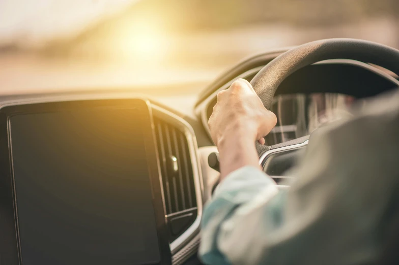 a man driving a car with his hand on the steering wheel, by Matt Cavotta, pexels, square, morning sun, avatar image, high resolution image