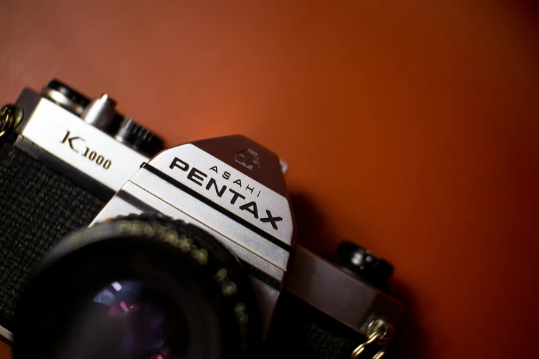 a black and white photo of a pentax camera, a picture, by Adam Rex, pexels contest winner, art photography, in retro colors, brown, medium format. soft light, shot on red camera
