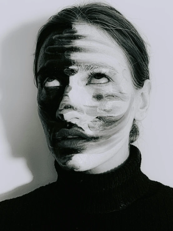 a black and white photo of a woman with makeup on her face, inspired by Anna Füssli, visible paint layers, black facemask, taken in the late 2000s, nina tryggvadottir