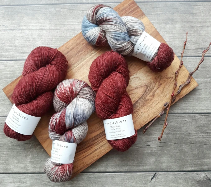 three skeins of yarn on a cutting board, instagram, hurufiyya, payne's grey and venetian red, thumbnail, new release, inauguration