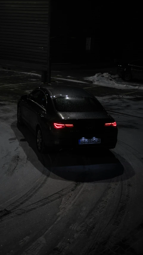 a car that is sitting in the snow, by Adam Szentpétery, reddit, dynamic lights, low quality photo, back lit, ( ( dark skin ) )