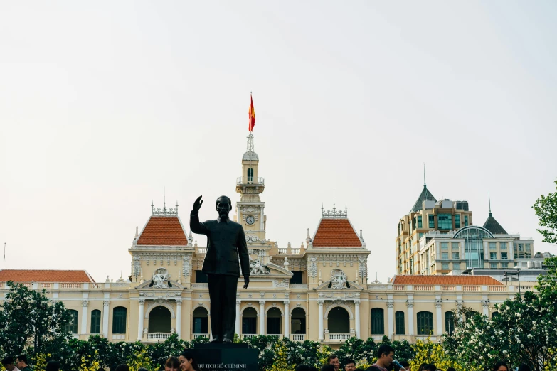 a statue of a man in front of a building, pexels contest winner, vietnam, square, 🚿🗝📝