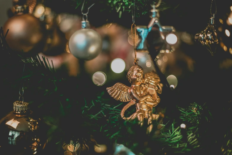 a close up of a christmas tree with ornaments, by Emma Andijewska, pexels contest winner, baroque, biblically acurate angel, retro stylised, thumbnail, high angle close up shot