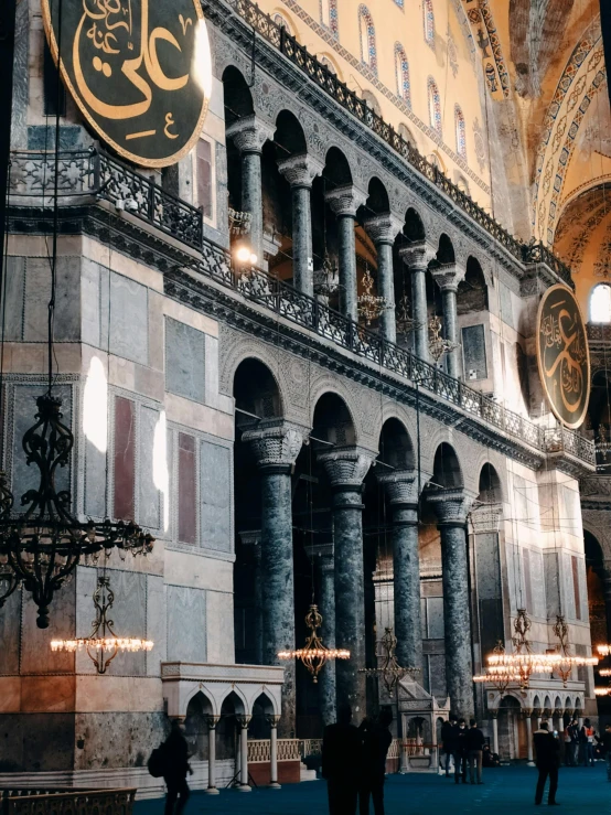 a group of people standing inside of a building, inspired by Modest Urgell, pexels contest winner, baroque, byzantine mosaic, grey and gold color palette, 🚿🗝📝, mosque interior