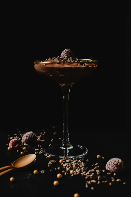 a chocolate dessert sitting on top of a table, a portrait, by Ndoc Martini, pexels, standing with a black background, bubbly, sea of parfait, background image