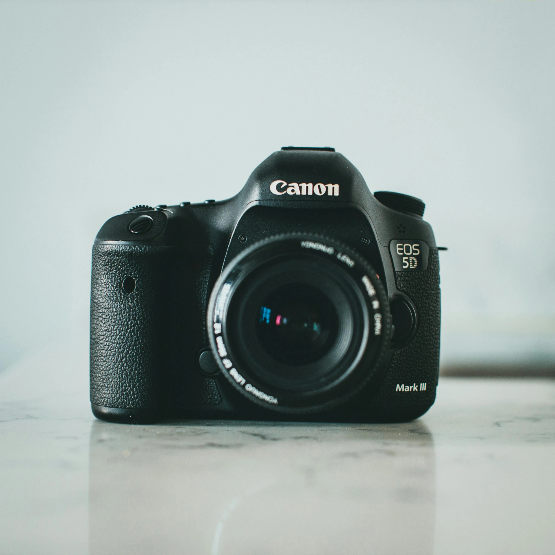 a canon camera sitting on top of a table, by Carey Morris, pexels contest winner, canon 5d mark iii, soft light.4k, front profile shot, instagram picture