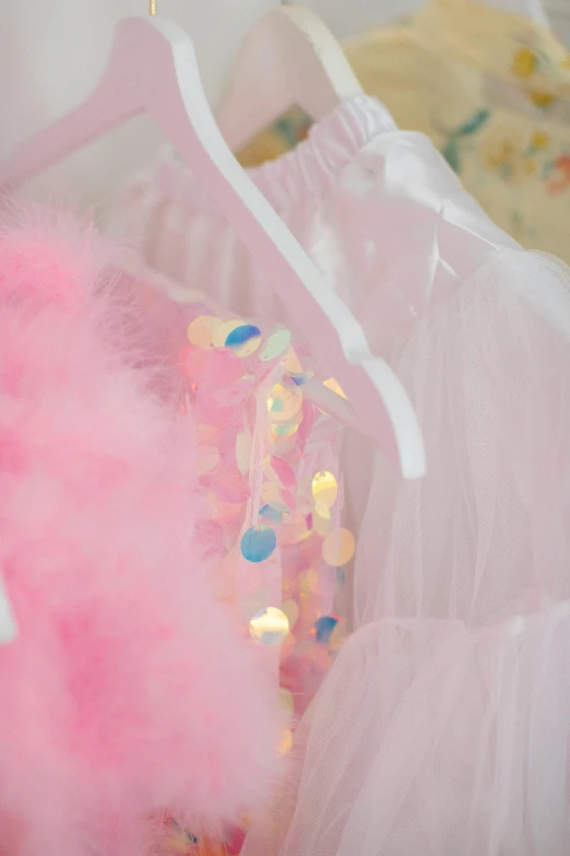 a close up of a dress on a hanger, wearing a tutu, fluffy full of light, full product shot, confetti