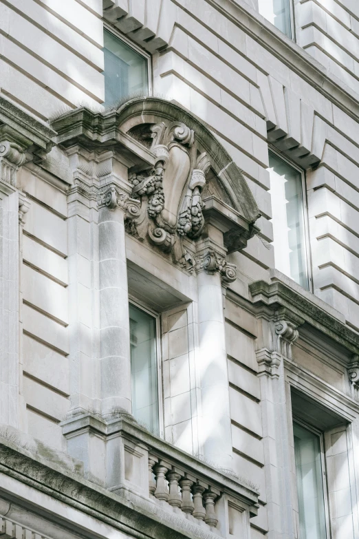 a clock that is on the side of a building, inspired by Sir Jacob Epstein, neoclassicism, ornate hair, concrete building, window ( city ), 2019 trending photo