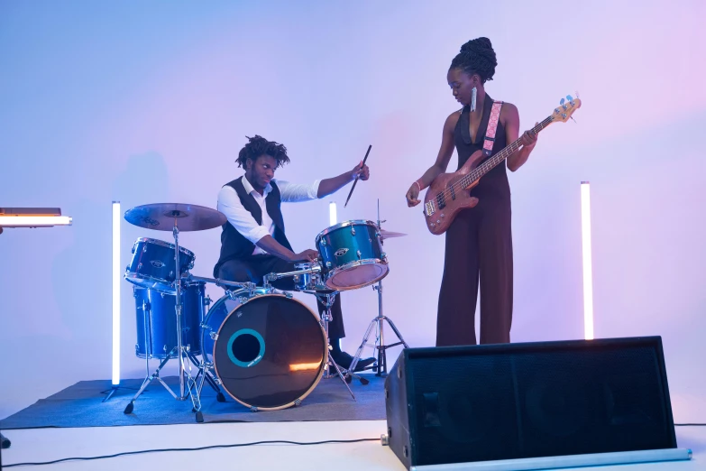 a couple of people that are on a stage, an album cover, by Bertram Brooker, pexels contest winner, funk art, bassist, performing a music video, ebony, 15081959 21121991 01012000 4k