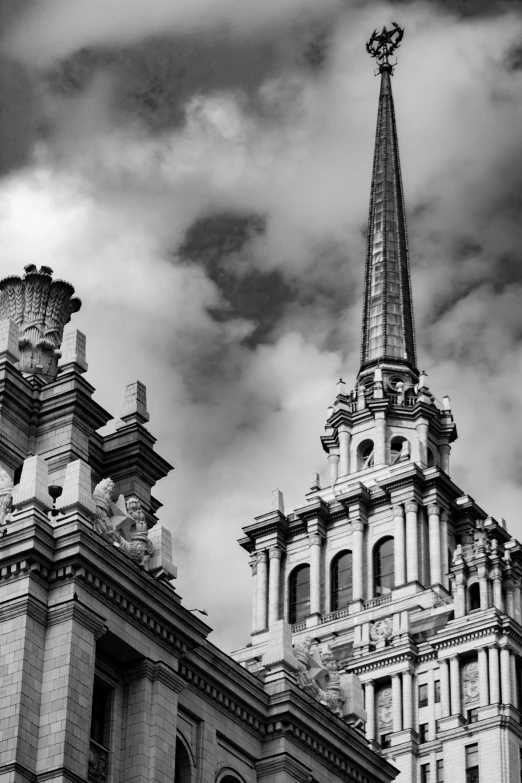 a black and white photo of a church steeple, a black and white photo, inspired by Christopher Wren, baroque, in moscow centre, asymmetrical spires, santiago calatrava, neoclassical police station