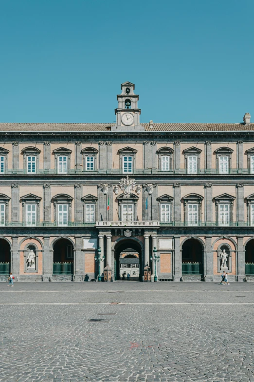 a large building with a clock on top of it, an album cover, by Carlo Martini, pexels contest winner, renaissance, naples, symmetrical front view, 2 5 6 x 2 5 6 pixels, panoramic