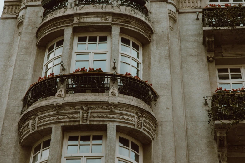 a tall building with a clock on top of it, pexels contest winner, neoclassicism, bay window, concrete balcony, high quality screenshot, ornate french architecture