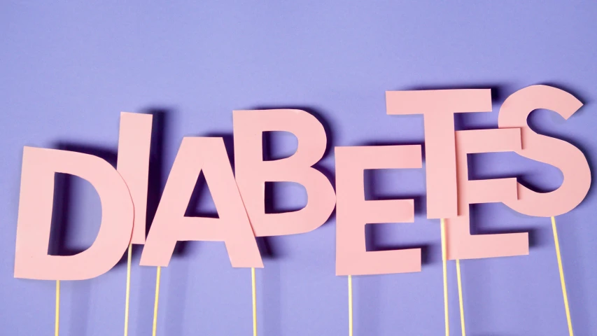 a sign that says diabets on a stick, by Rachel Reckitt, happening, medical background, background image, cut out of cardboard, lizzo