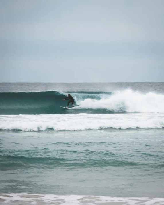 a man riding a wave on top of a surfboard, pexels contest winner, shades of blue and grey, low quality photo, thin lines, barrels