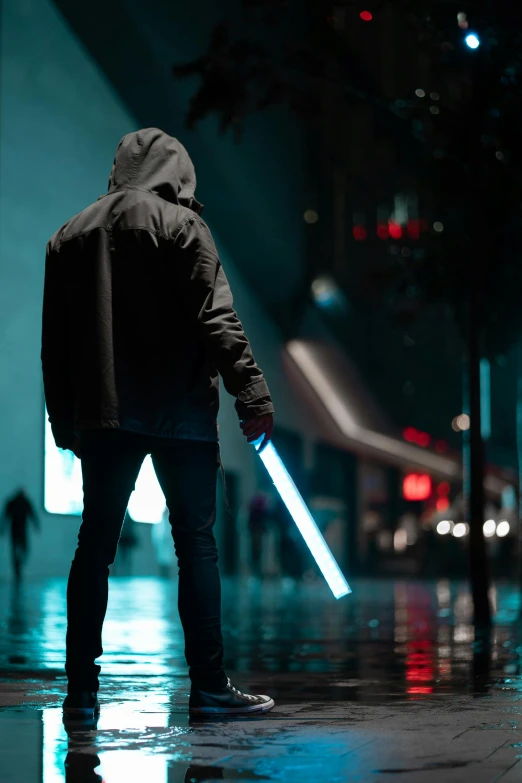a person standing in the rain with a light saber, cyberpunk art, unsplash contest winner, holding a blue lightsaber, instagram post, standing in a city street, jedi knight