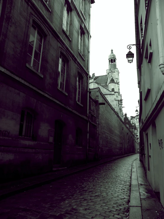 a narrow street with a clock tower in the distance, an album cover, pexels contest winner, paris school, ominous mood, square, high quality upload, low quality photo