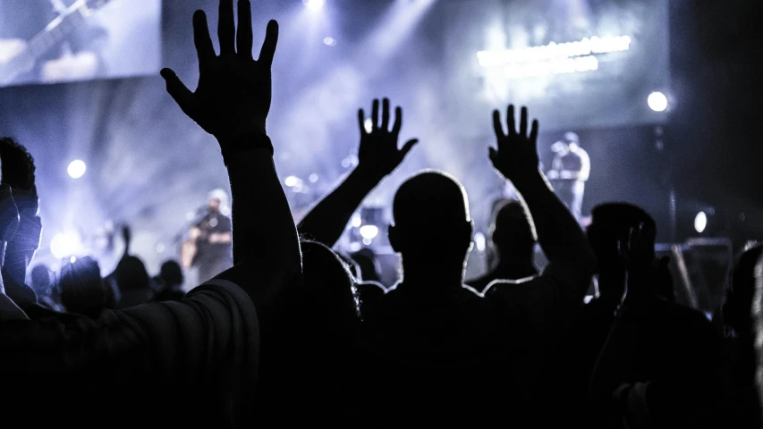 a crowd of people with their hands in the air, listening to godly music, profile image, billboard image