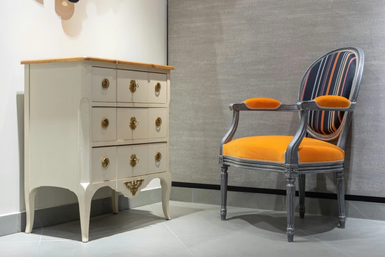 a chair and a chest of drawers in a room, trending on cg society, neoclassicism, grey orange, exhibition, thumbnail, limestone